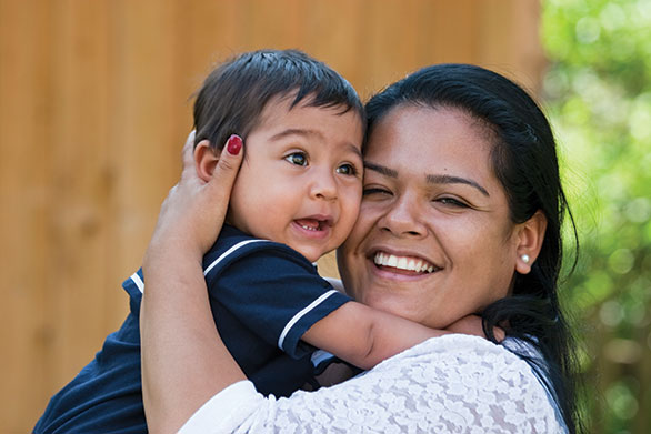 Photo of mother holding her child. Link to Life Stage Gift Planner Ages 22-44 Situations.